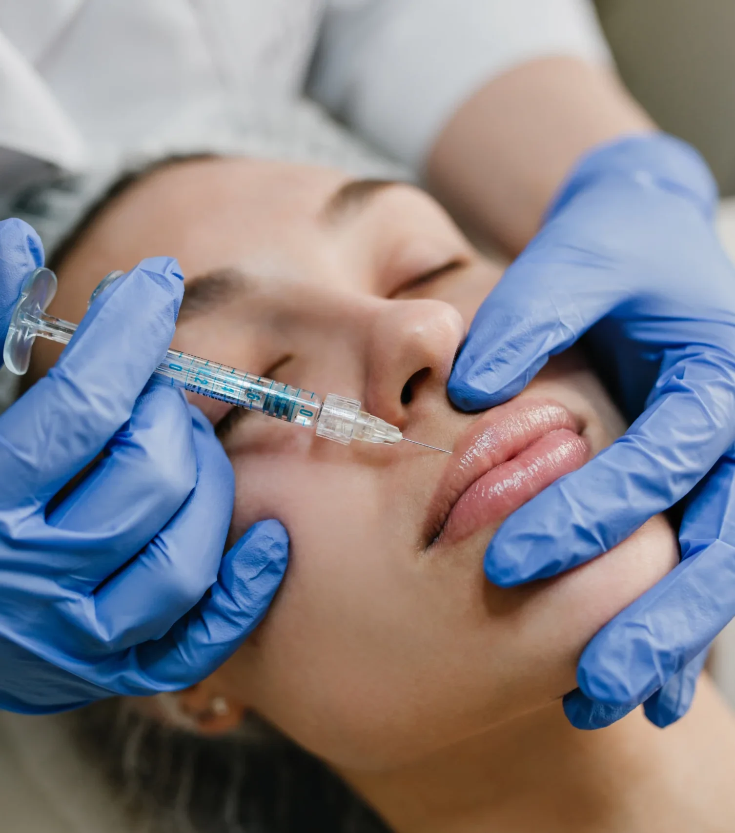 closeup-portrait-young-woman-doing-botox-procedures-by-professional-injection-making-lips-modern-devices-technology-medicine-cosmetology-therapy